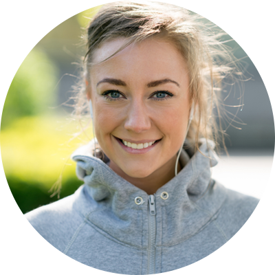 Smiling jogger in grey hoodie smiles