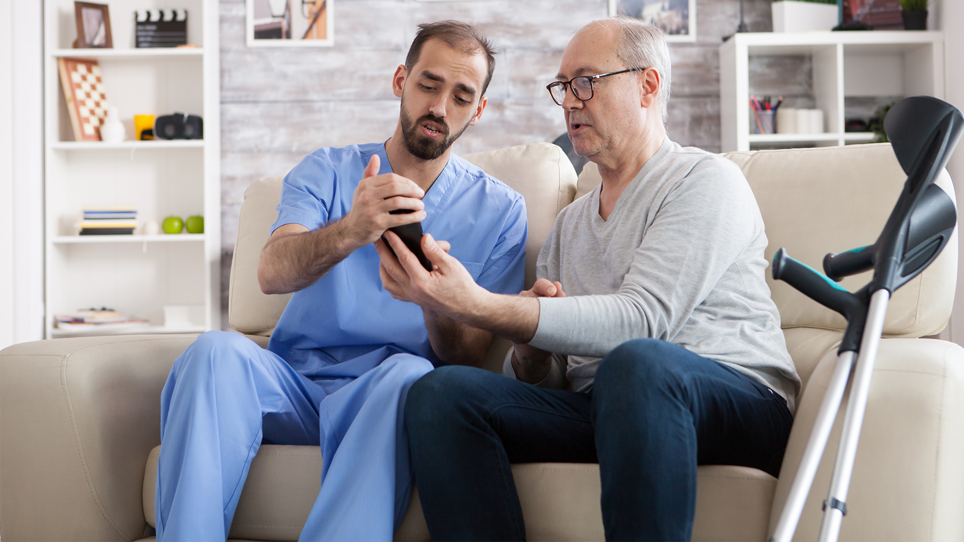 A doctor and patient use an Ad Astra phone interpreting services.