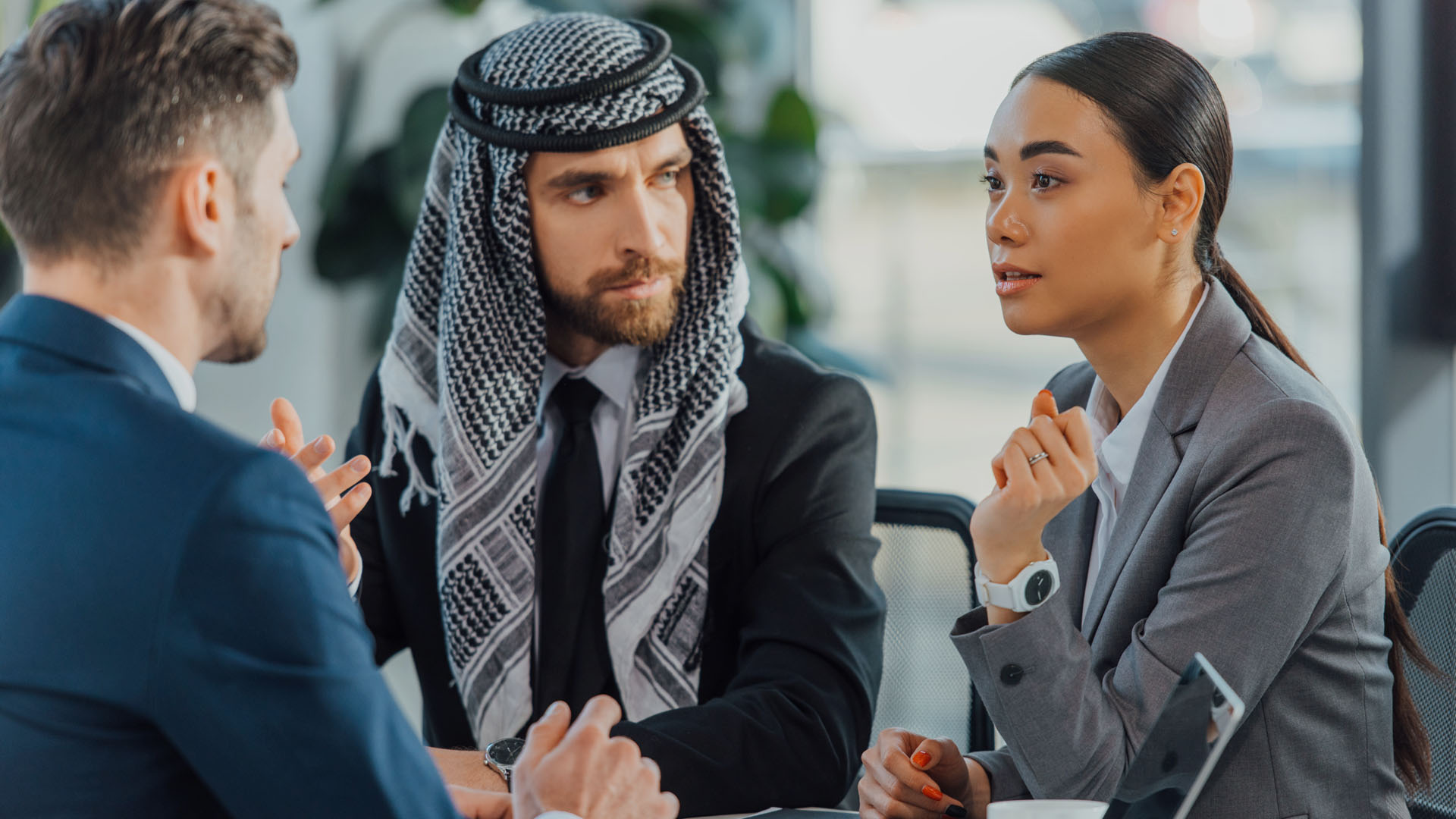 Man sits with an Ad Astra interpreter at a meeting