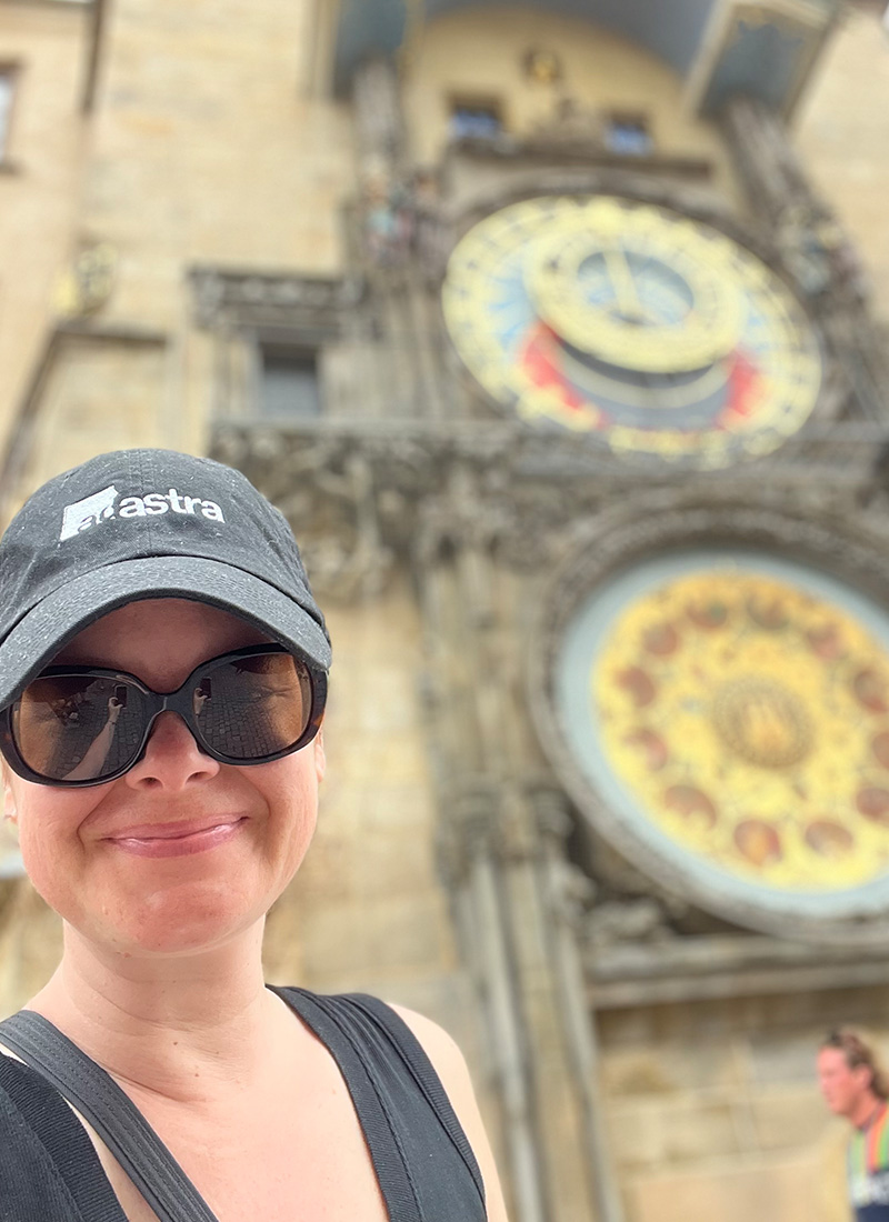 Ad Astra brand rep Karen smiles with an Ad Astra hat on and shades