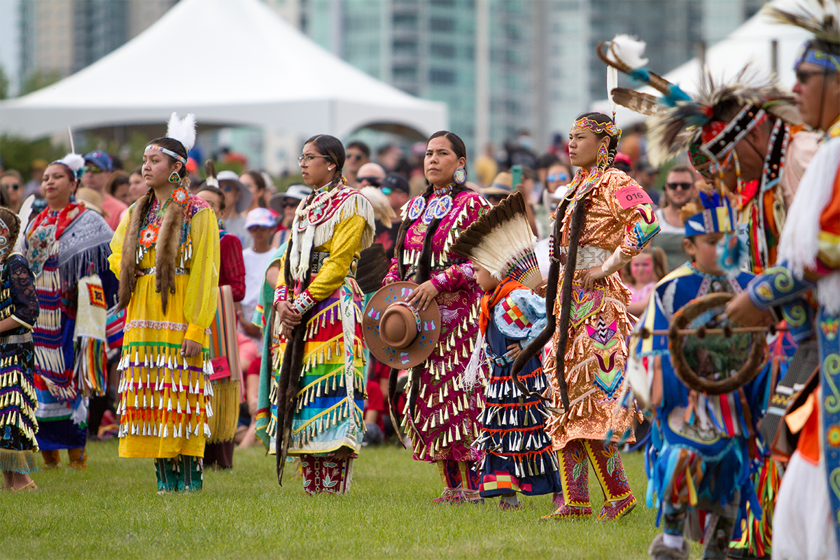 First Nations dancers watch the Canada Day celebrations in Calgary, Alberta