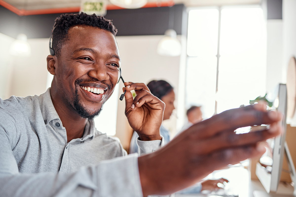 An Ad Astra operator explains to a customer the different Language Services in Insurance that are available.