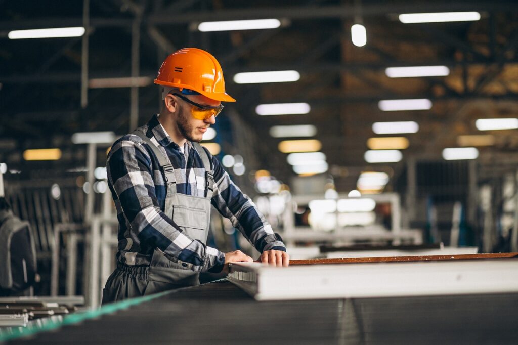 A heavy machinery man working in a factory